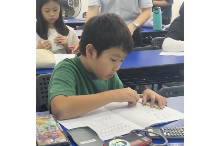 student-solving-problem-sums-in-class