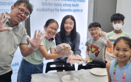 students holding fishes