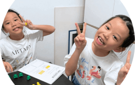 Two happy students in their Math lesson