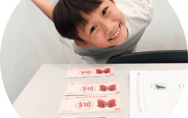 A student using vouchers to count money